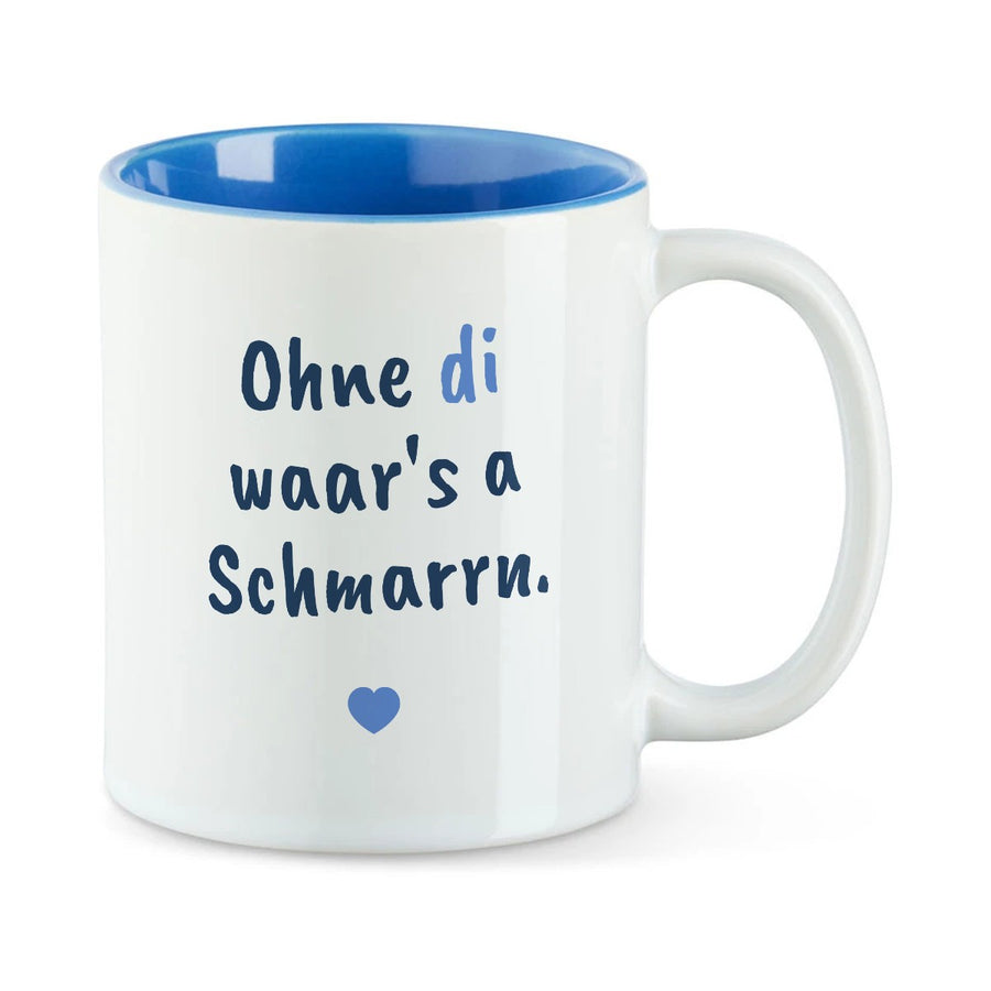 Weiße Tasse mit blauer Innenseite und dem bairischen Spruch „Ohne di waar's a Schmarrn.“ in Pinselschrift.