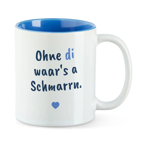 Weiße Tasse mit blauer Innenseite und dem bairischen Spruch „Ohne di waar's a Schmarrn.“ in Pinselschrift.