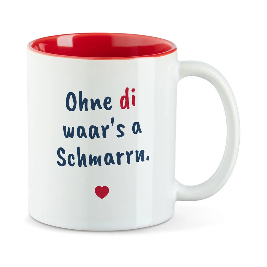Weiße Tasse mit roter Innenseite und dem bairischen Spruch „Ohne di waar's a Schmarrn.“ in Pinselschrift.
